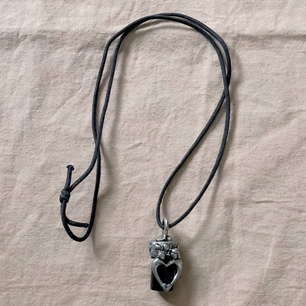 Handmade Vintage Potion Heart Love Symbol Pendant with an ointment oil bottle.